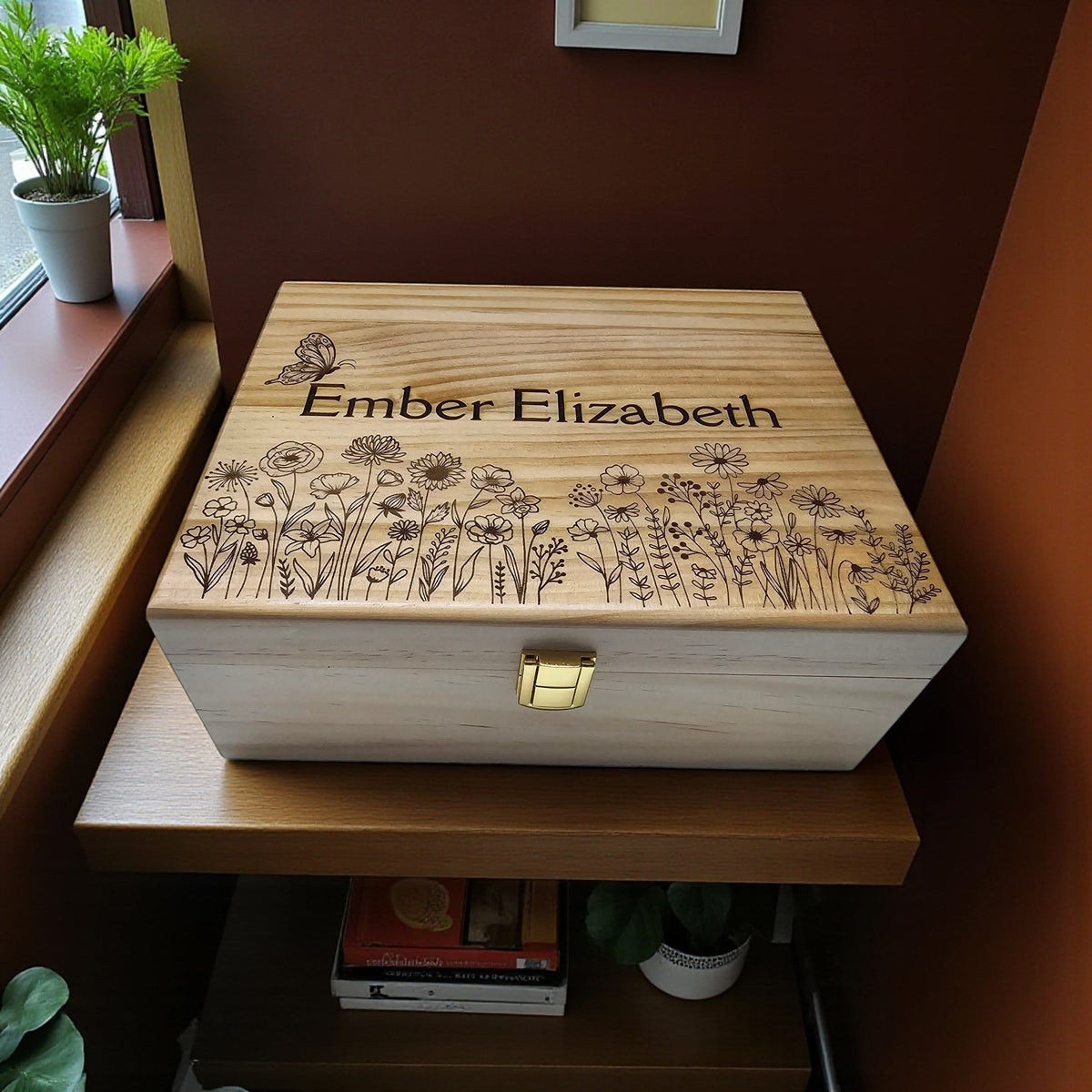 Newfashioned Relics personalized wooden keepsake box with engraved butterfly and wildflower design on the lid.