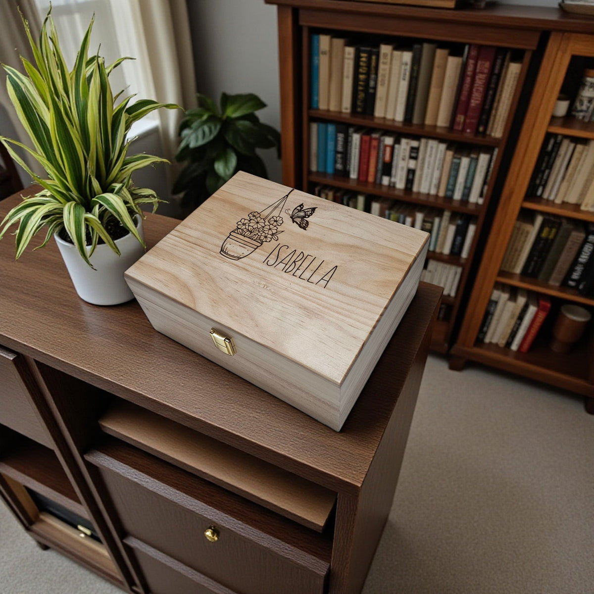 Newfashioned Relics personalized wooden keepsake box with engraved butterfly and floral design on a wooden cabinet.