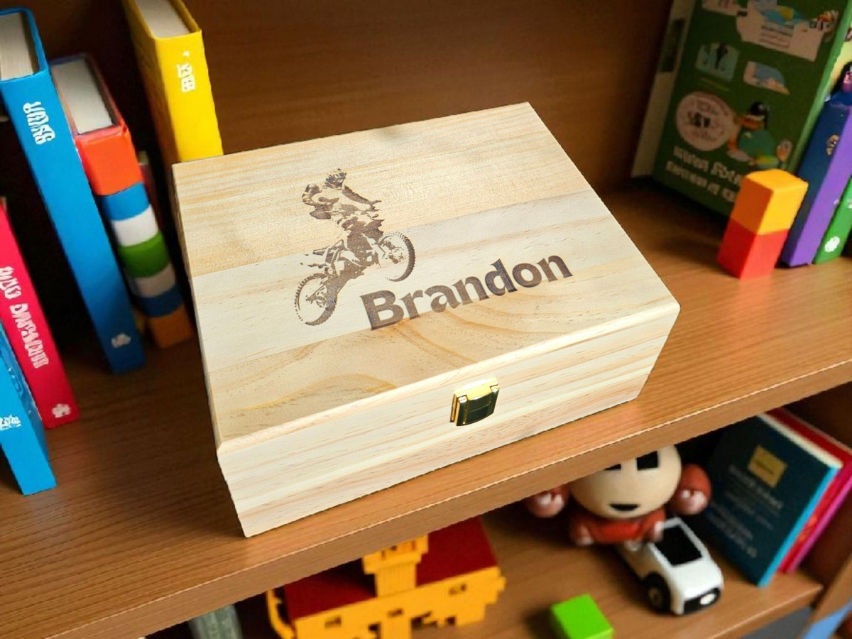 Newfashioned Relics personalized wooden keepsake box with a motocross engraving and the name Brandon on a toy shelf.