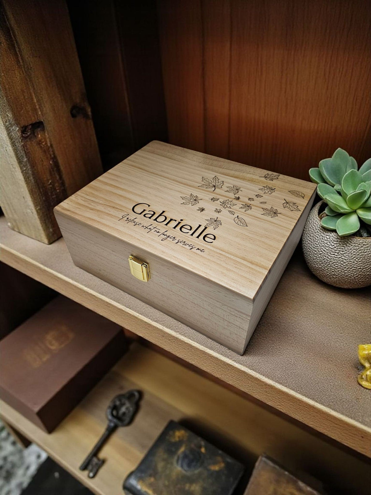 Newfashioned Relics personalized wooden keepsake box with engraved name Gabrielle and leaf design on a shelf