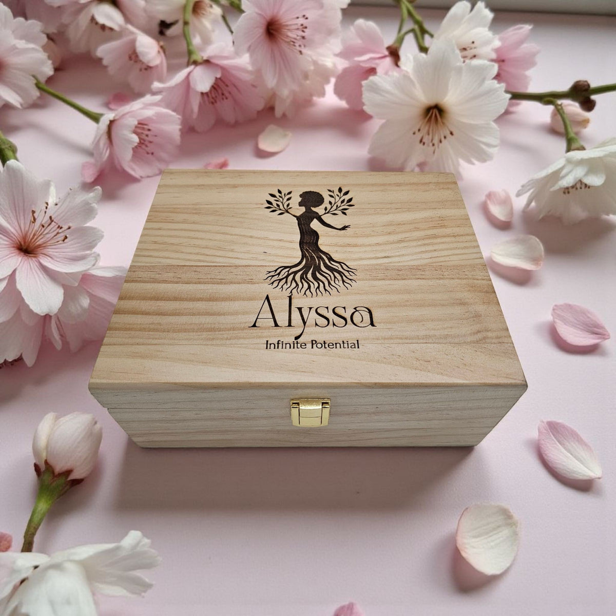 Newfashioned Relics personalized wooden keepsake box with tree of life engraving and name Alyssa on a pink floral background